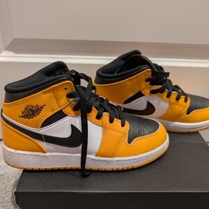 Jordan Black and Yellow Sneakers with Iconic Silhouette